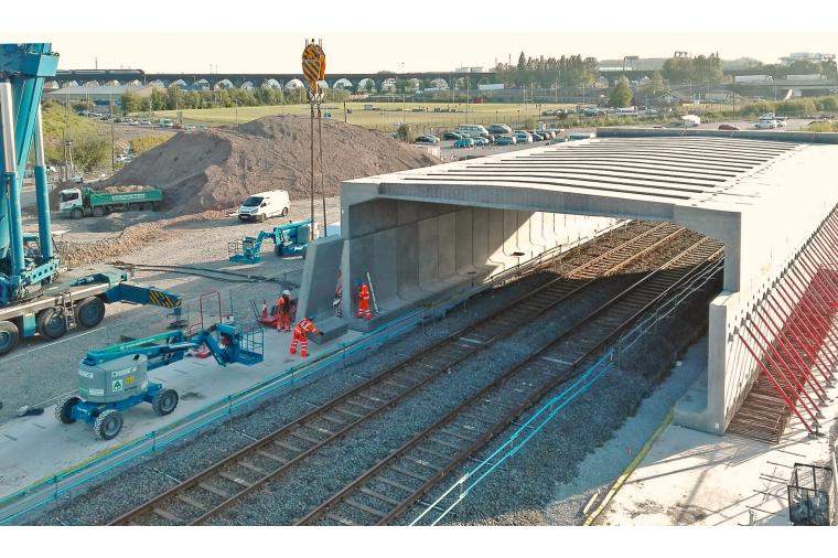 1) The skew-bridge is sited where the main north and southbound carriageways cross a rail freight line