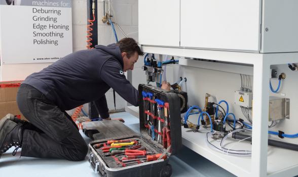 4) Richard connects up water and electricity to the new stream finishing machine